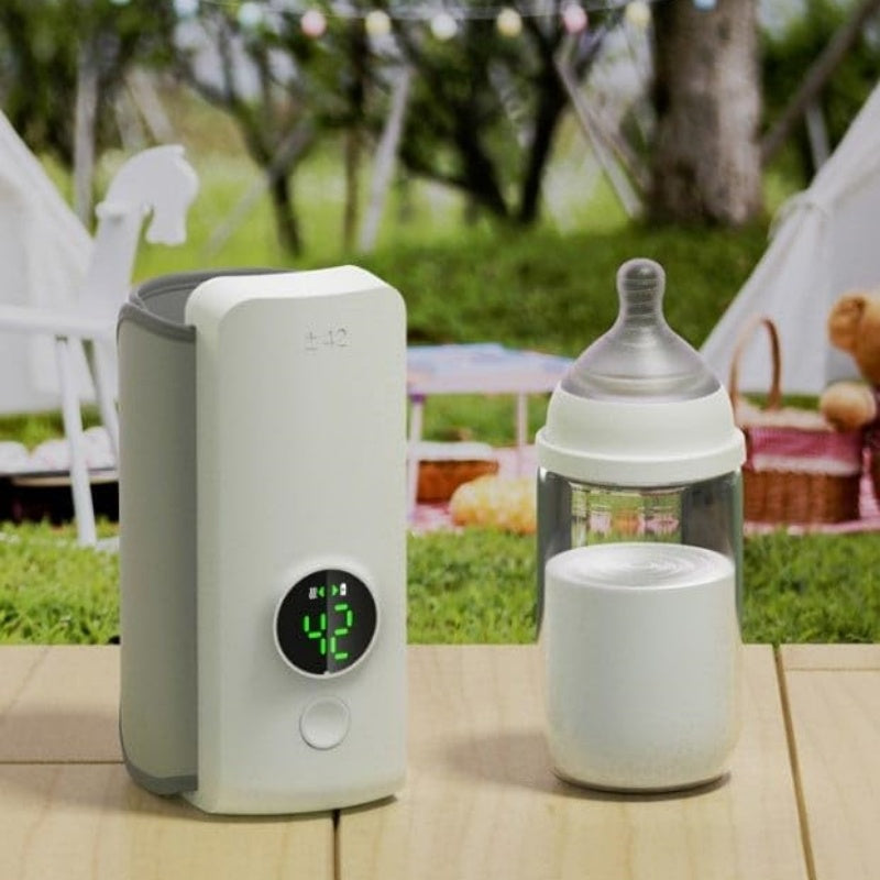 Calentador portátil de leche para el bebé. Carga USB, mantiene la temperatura constante de la leche o calienta el agua de la botella.