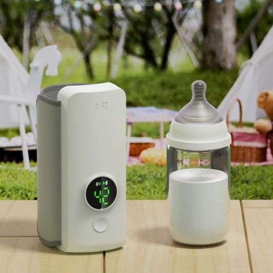 Calentador portátil de leche para el bebé. Carga USB, mantiene la temperatura constante de la leche o calienta el agua de la botella.